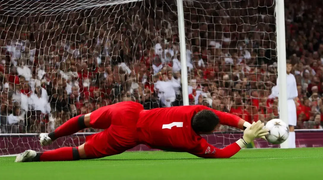 Portogallo portiere visto di spalle che si tuffa a braccia spiegate per parare un rigore in uno stadio affollato al Mondiale 2006