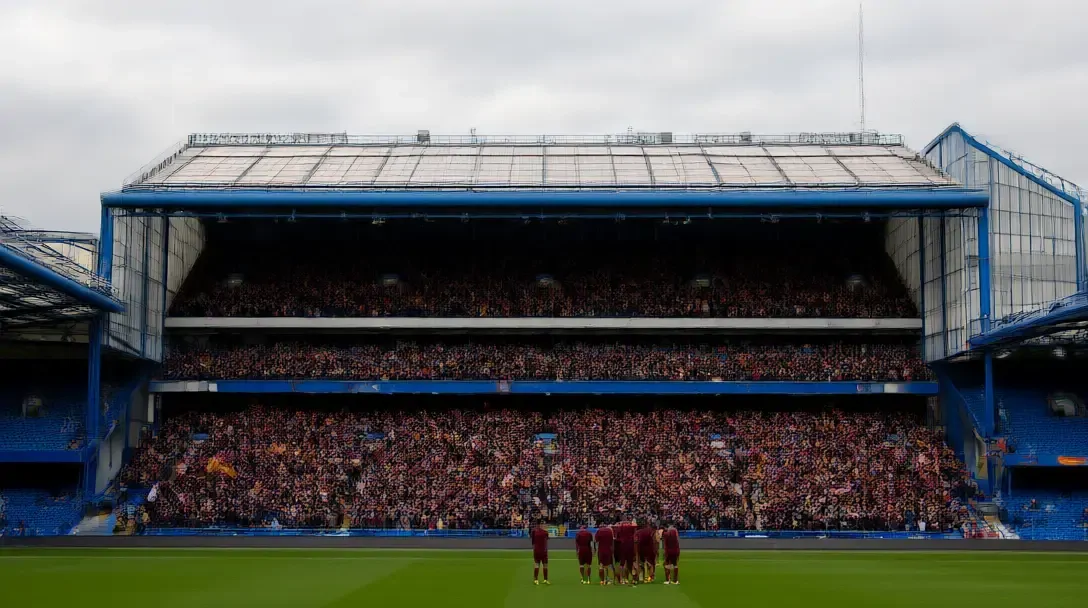 Tifosi del Bradford City in claret e ambra che celebrano nella tribuna degli ospiti allo Stamford Bridge, con i posti dei padroni di casa vuoti